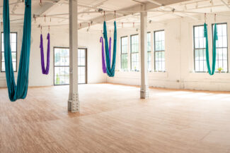 Our studio space for rent has high ceilings, white walls, lots of windows and is brightly-lit full of natural light.