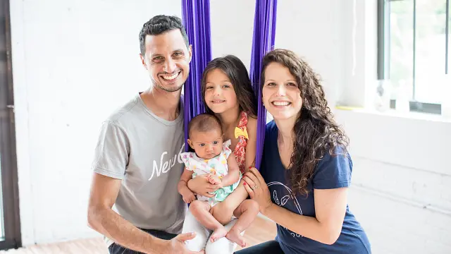 Earth & Aerial Yoga studio owner Lora Markova poses with family during a press release photo-shoot for the studio.
