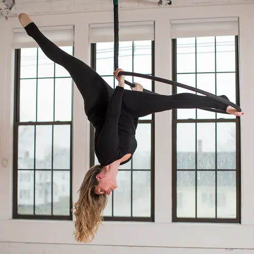 Lyra student showcases an inverted split during one of Earth and Aerial Yoga's advanced level Lyra classes in Hudson MA.